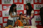 Esha Kopikkar blindfolding Rama Kesariwala at BIG Green Ganesha_s event in Mumbai on 29th Aug 2011.JPG